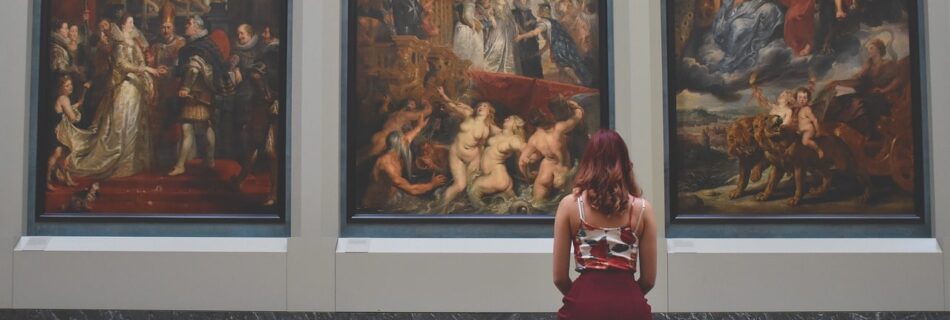 Woman looks at the huge work of art