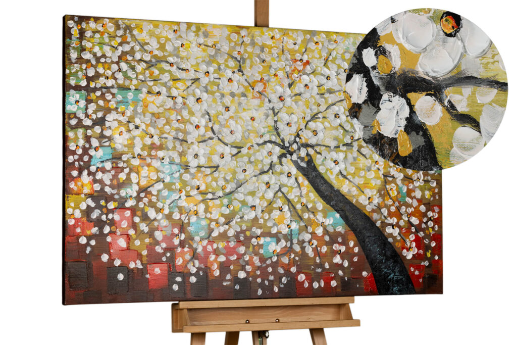 A wide, vibrant handmade canvas painting titled "Magic in the treetops" featuring a detailed tree with dense white and yellow blossoms.